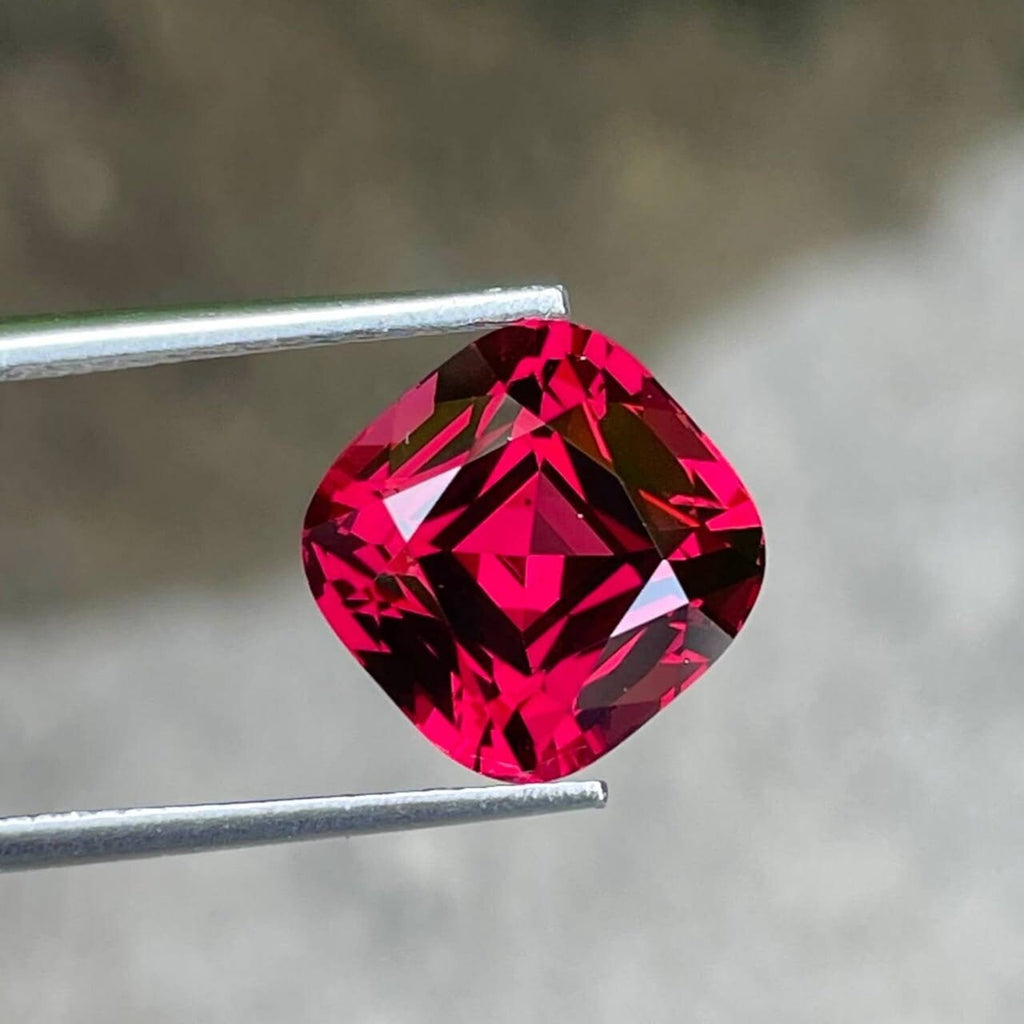 Tanzanian Pink Red Garnet: 8.46 Carat Cushion Cut Gemstone