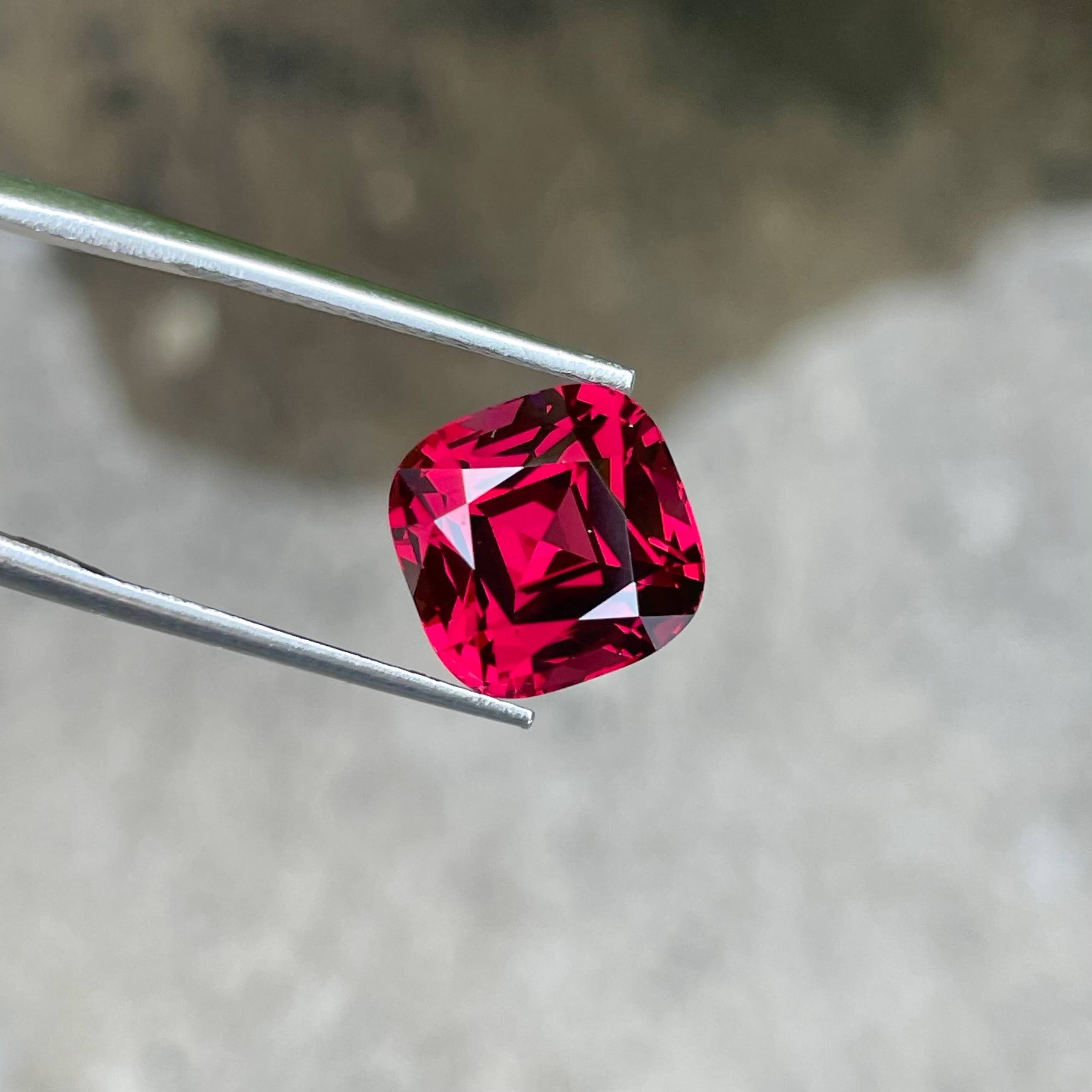 Tanzanian Pink Red Garnet: 8.46 Carat Cushion Cut Gemstone