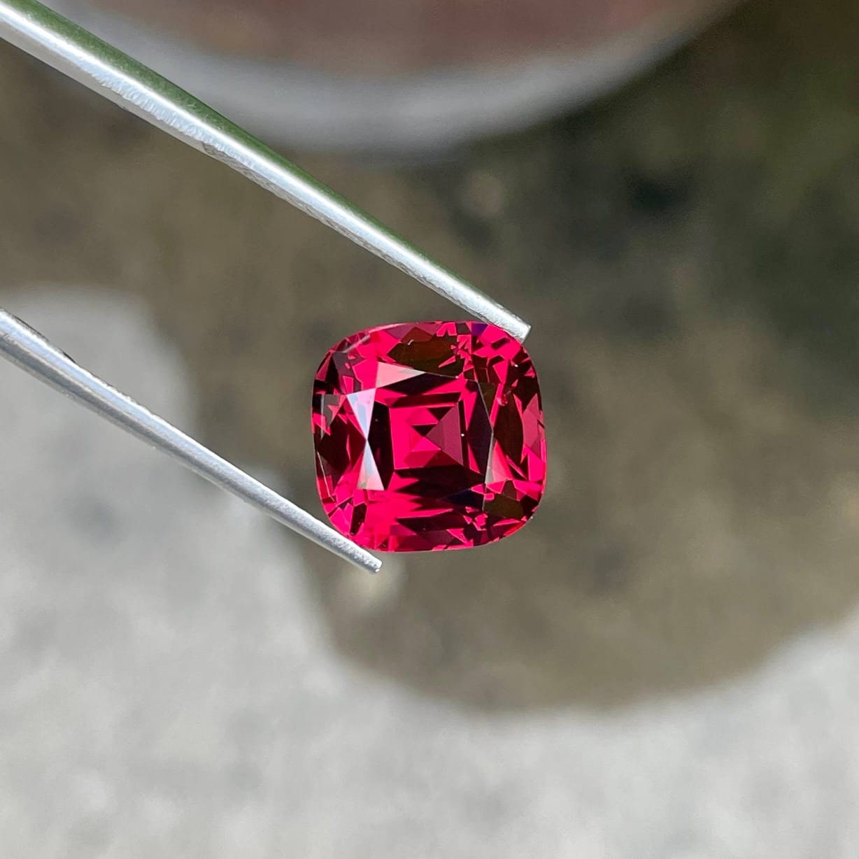 Tanzanian Pink Red Garnet: 8.46 Carat Cushion Cut Gemstone