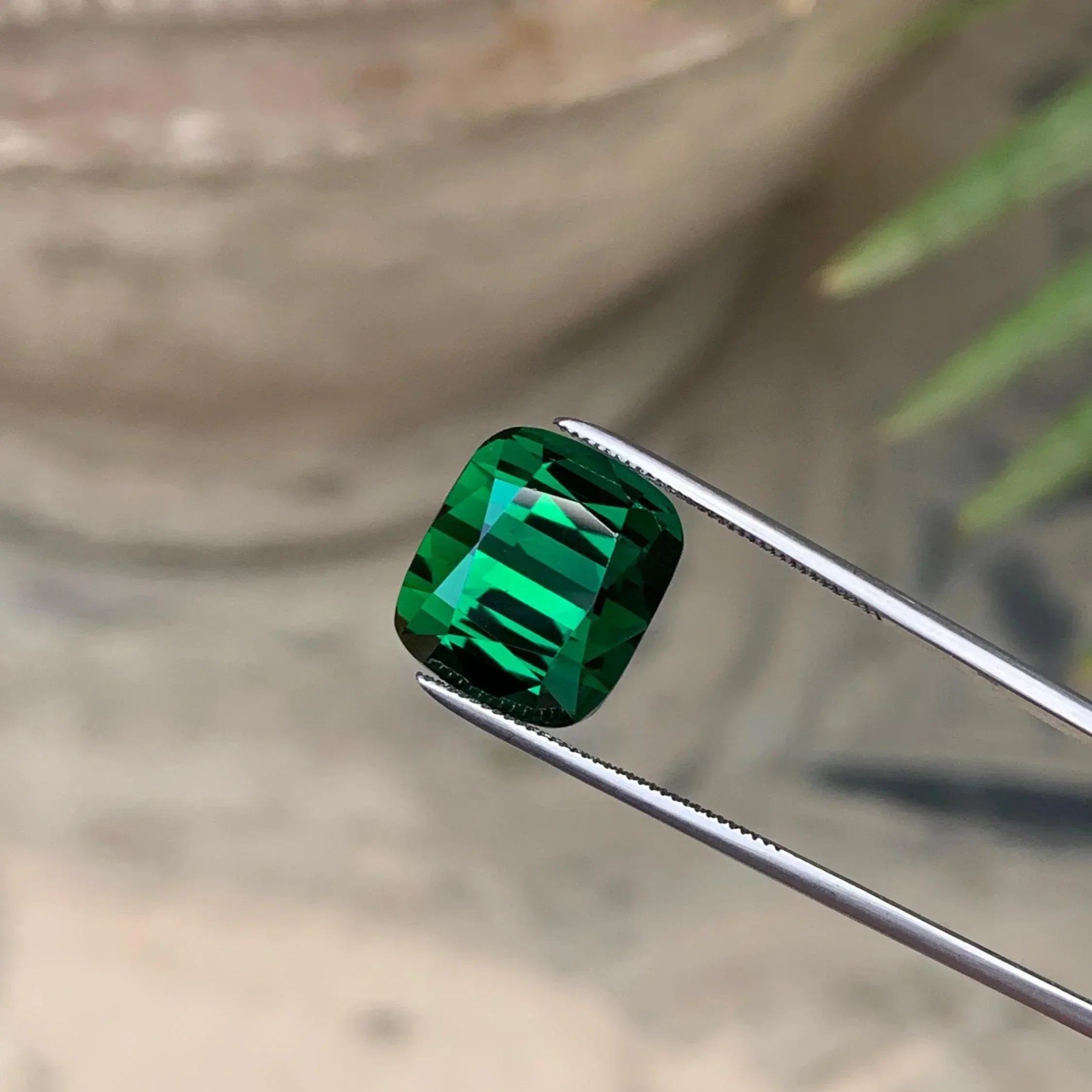Deep Green Tourmaline: 11.70 ct Cushion Cut Gemstone from Afghanistan - Splendor Gems