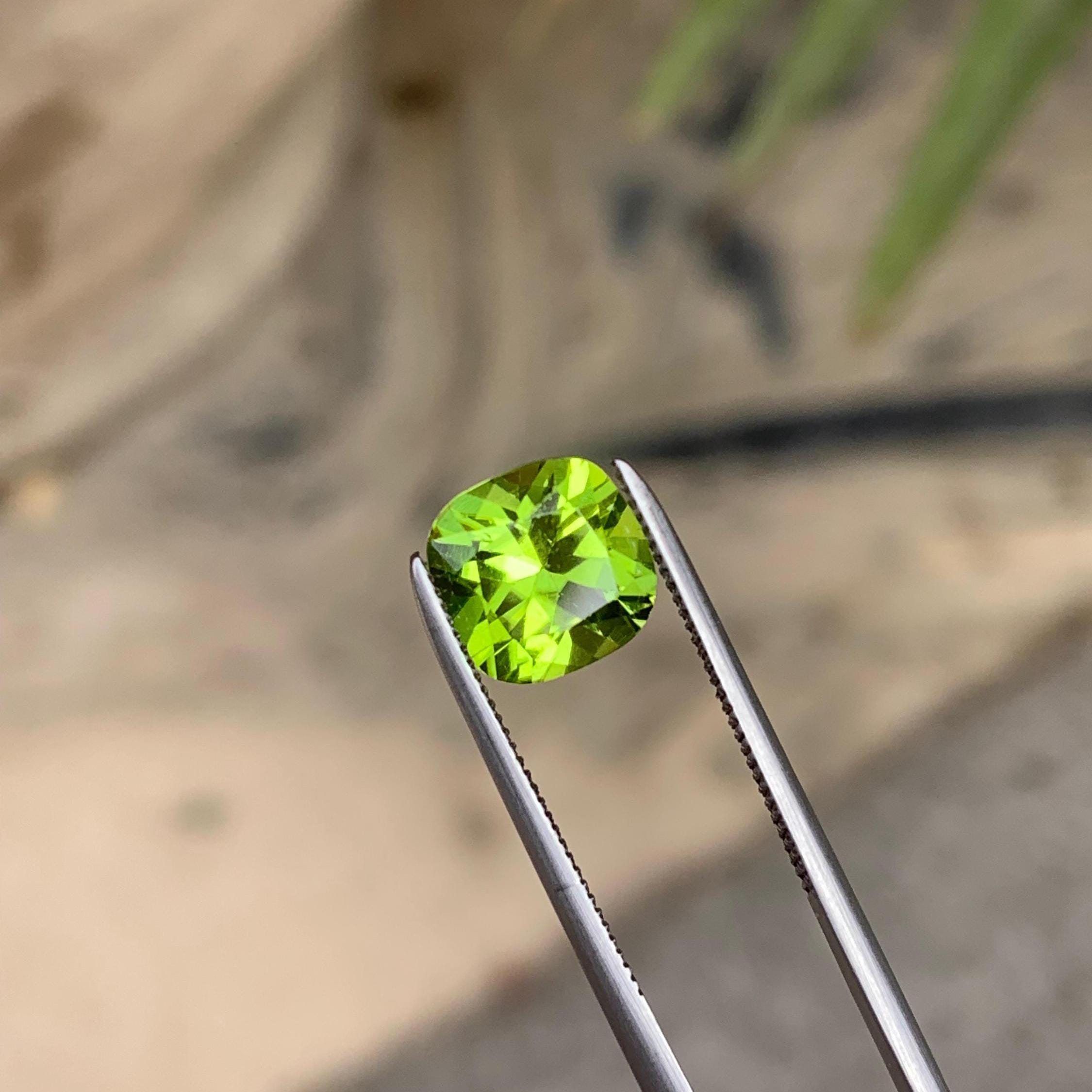 Flower Cut Peridot Stone: 2.05 ct, Pakistan VSI Cushion Cut Secondary image