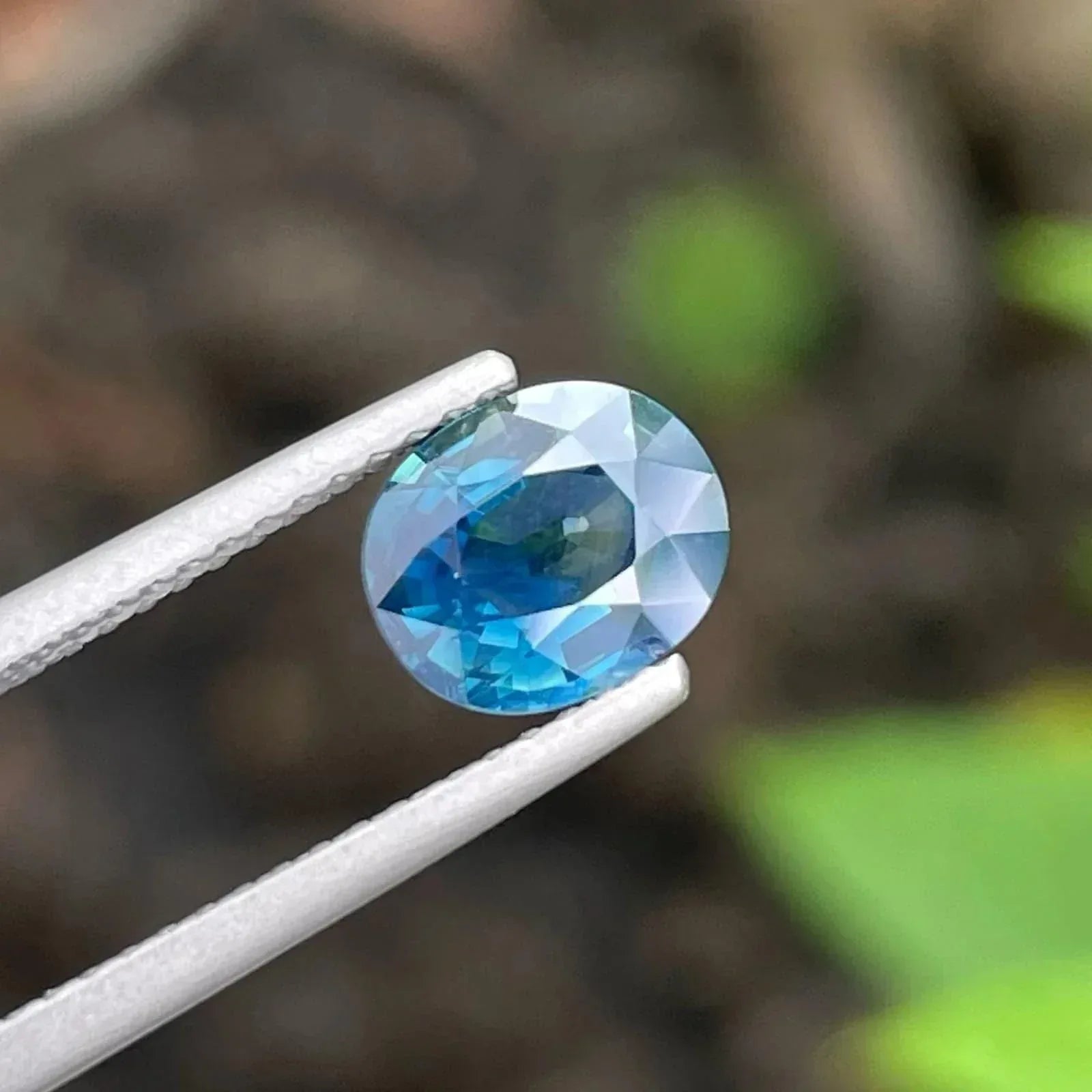 AIG Certified Teal Sapphire Gemstone: 1.56 CT Oval, Untreated - Splendor Gems