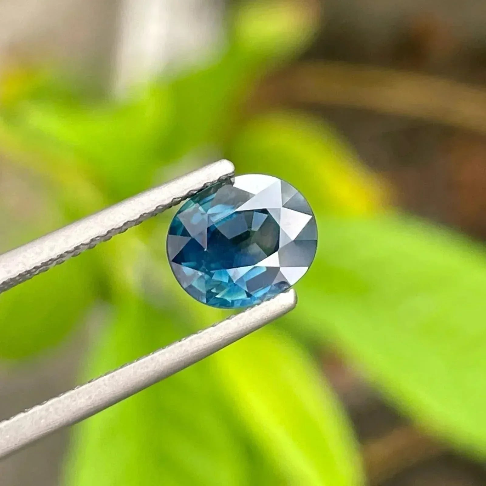 AIG Certified Teal Sapphire Gemstone: 1.56 CT Oval, Untreated Secondary image