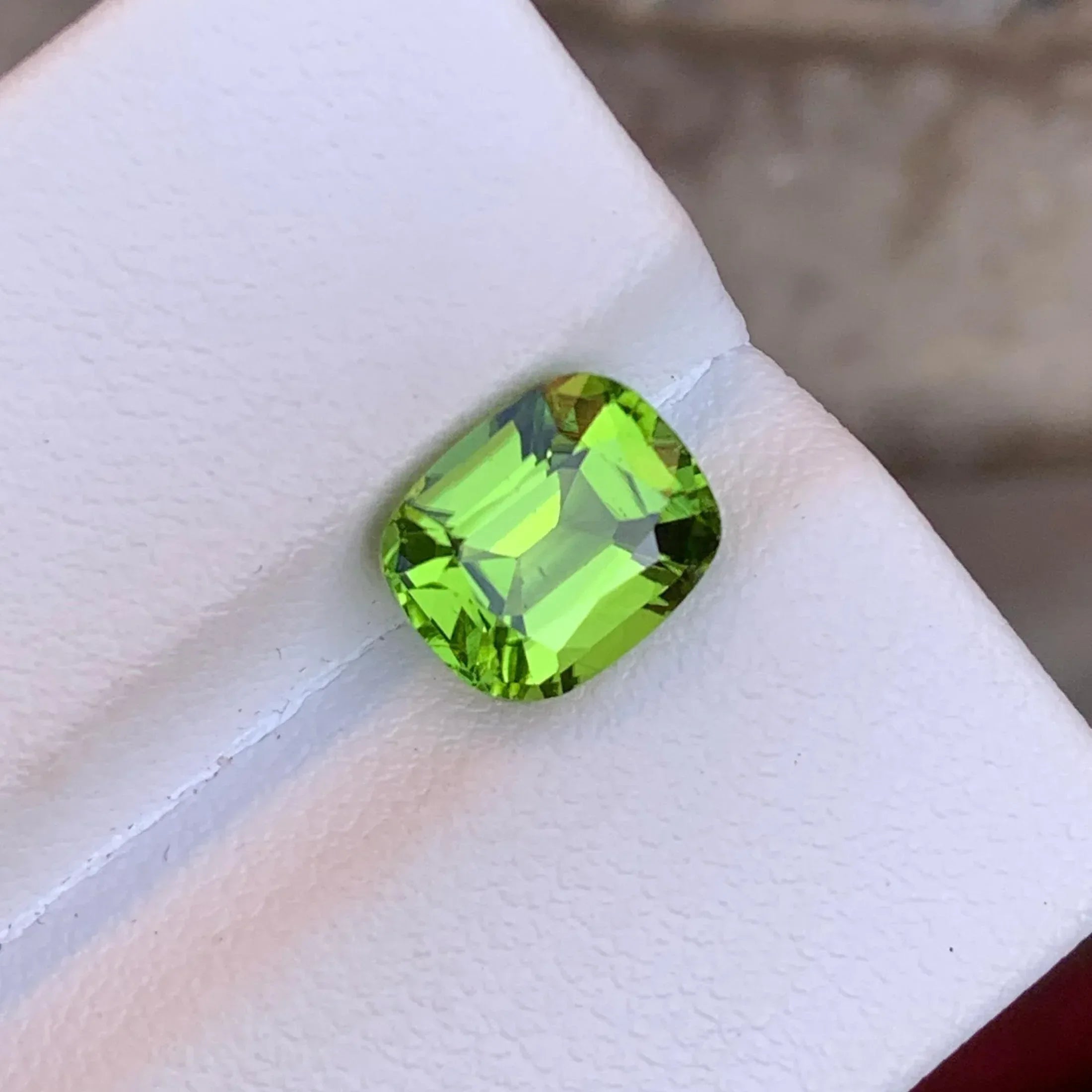 Apple Green Peridot Stone: 2.55 CTS Cushion Cut, Pakistan Origin - Splendor Gems
