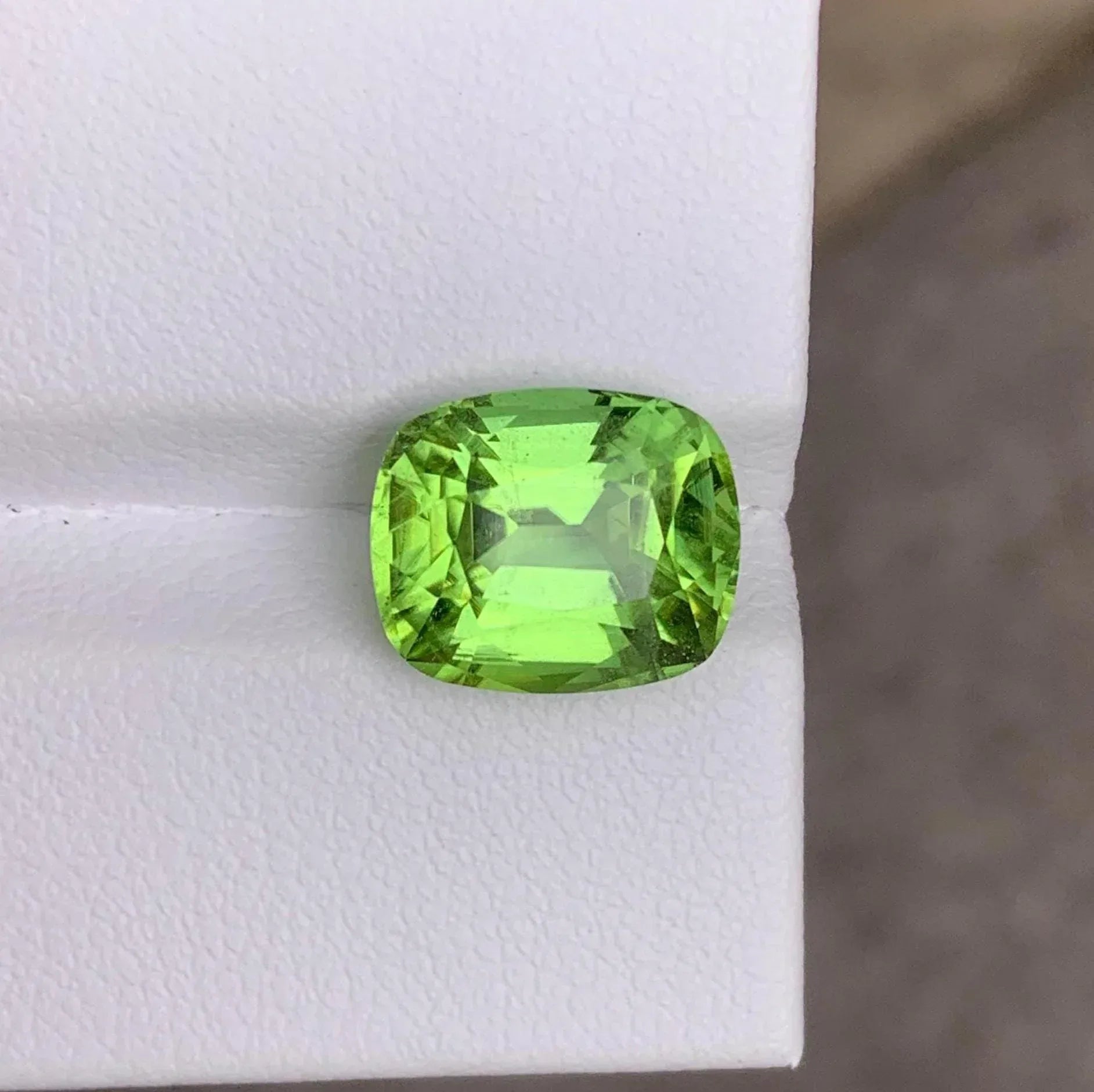 Faceted Cushion Cut Peridot Gemstone: 6.10 Carats, Pakistan Origin - Splendor Gems
