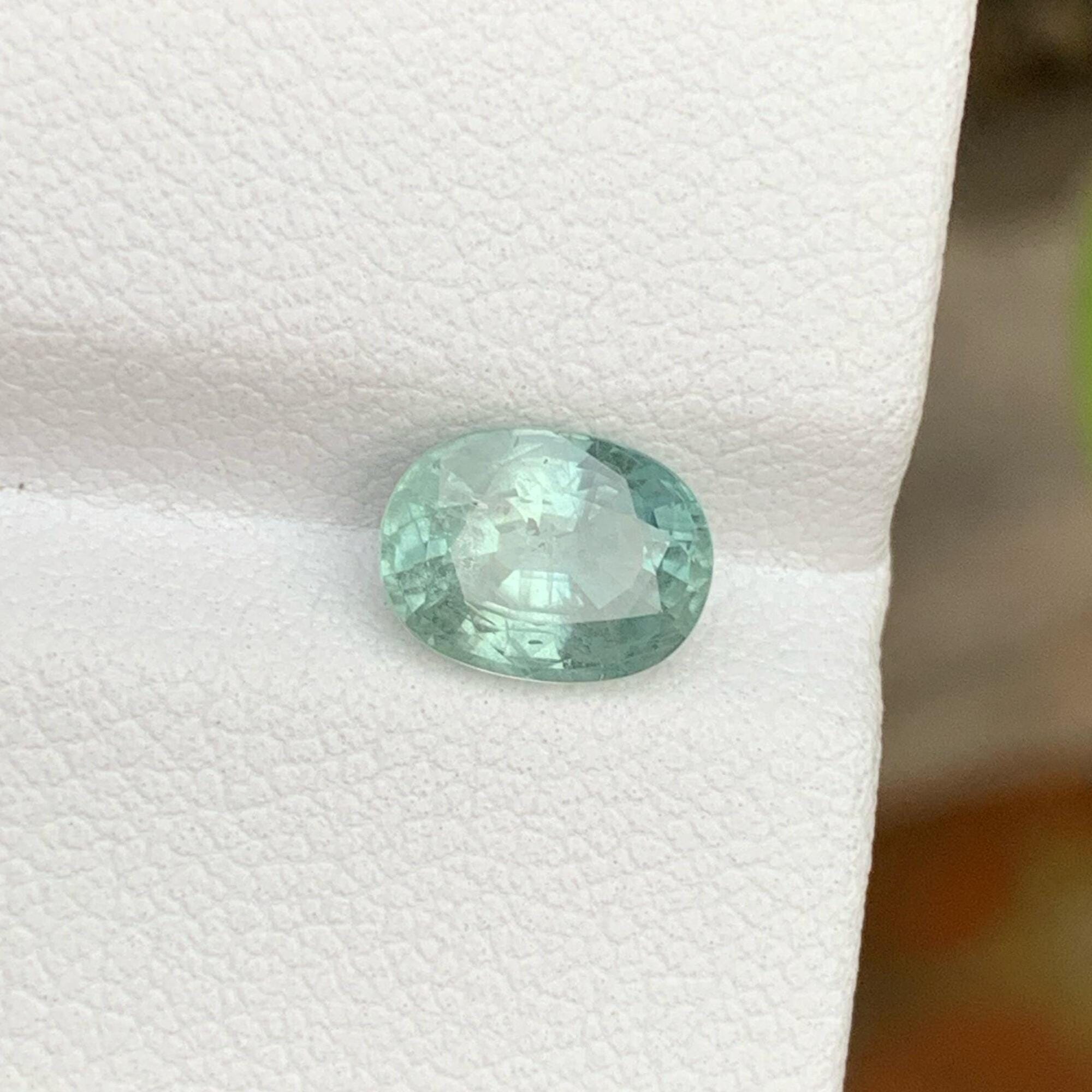 Iceberg Bi Color Sapphire: 1.95 Carat Faceted Oval Gemstone Secondary image
